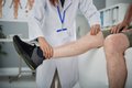 physiotherapist-palpating-leg.jpg